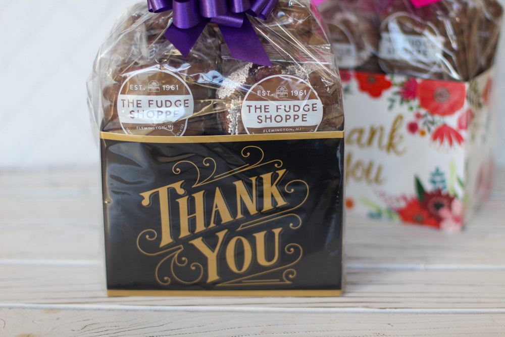 box with 'Thank You' text and a purple bow, branded 'The Fudge Shoppe'.