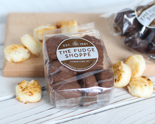 chocolate macarons on a wooden surface