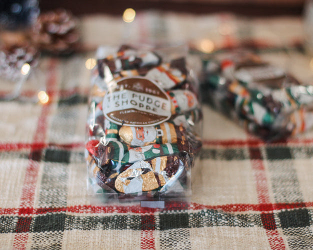 dark chocolate santas on a plaid tablecloth