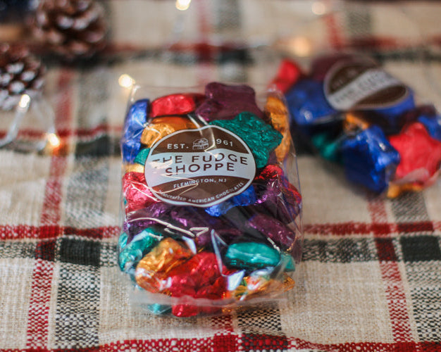 foiled chocolate stars on a plaid tablecloth