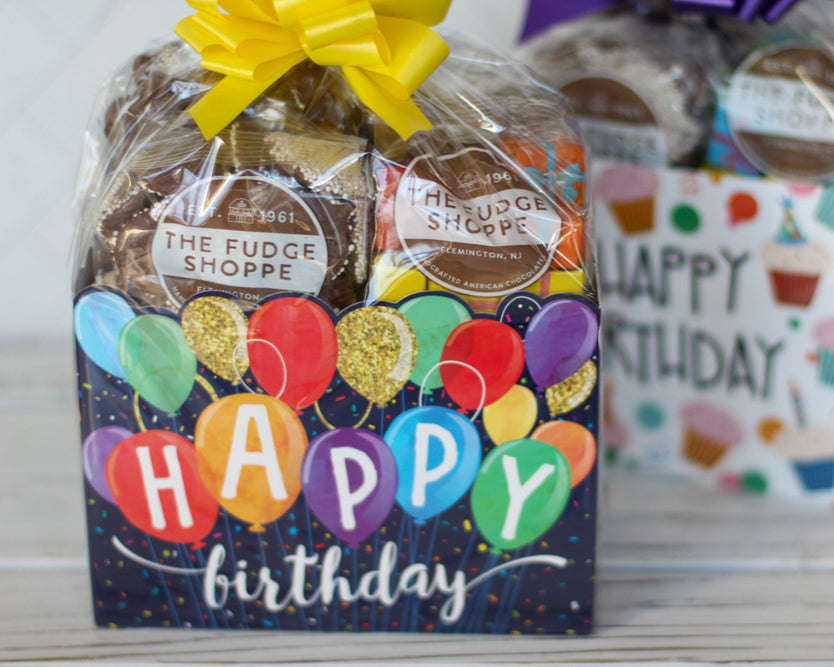 happy birthday boxes with wood background.