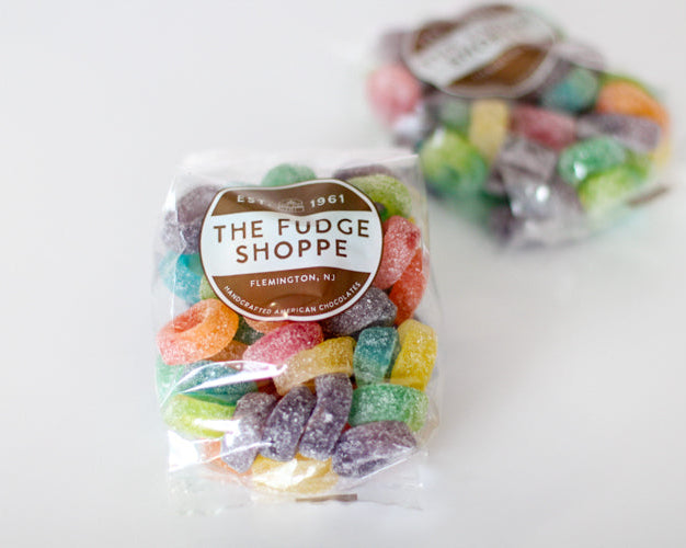 sour ring gummy candies with 'The Fudge Shoppe' label on a white background