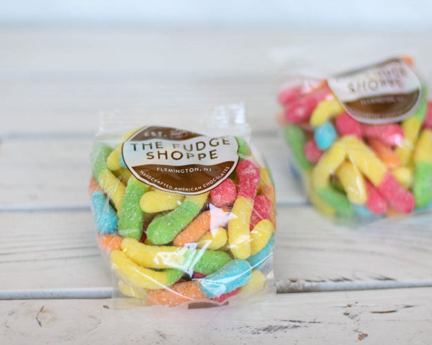 sour worms against a white background