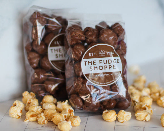 Chocolate Covered Caramel Corn with popcorn pieces and caramel shells on a light background.