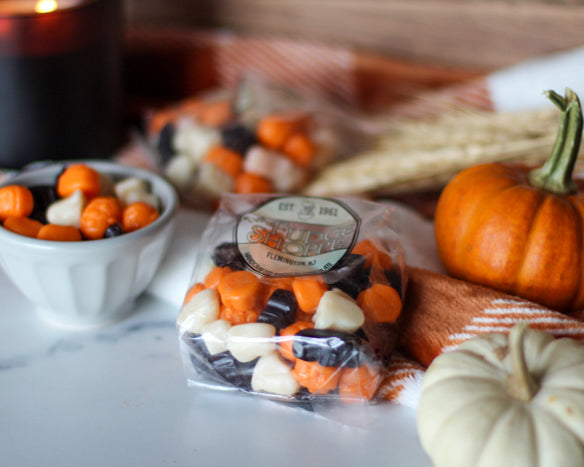halloween colored gummis with a fall background
