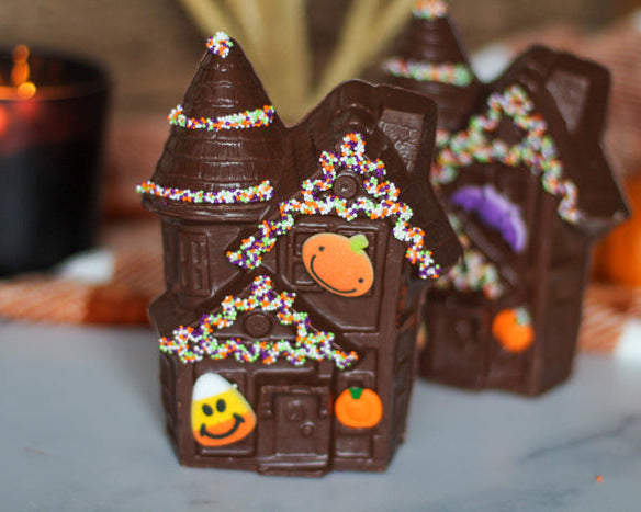 Halloween Chocolate Cottage Mold with fall decorations around