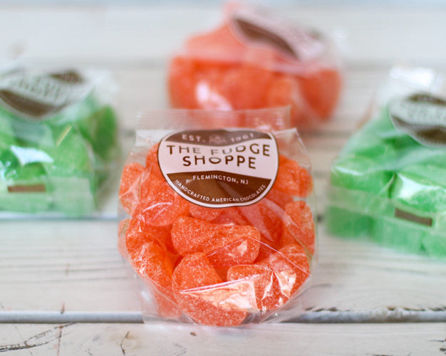 orange spearmint slices on a white wood background