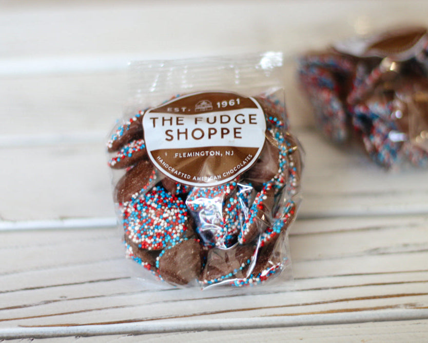 packaged non pareils on a wood background