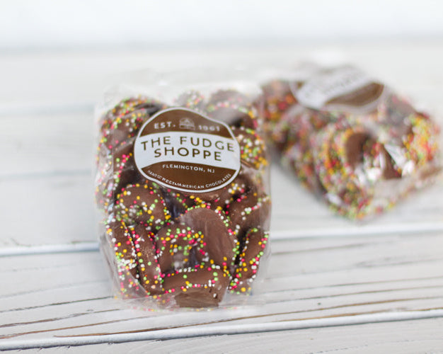 spring sprinkle pretzels on a white wooden background