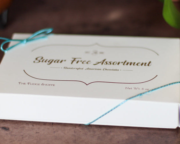Box of sugar-free assortment with a string on a wooden surface