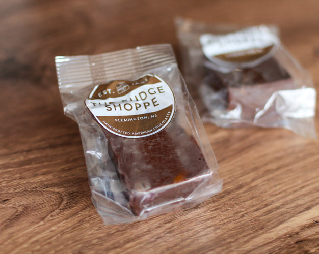 Two packages of candy on a wooden surface